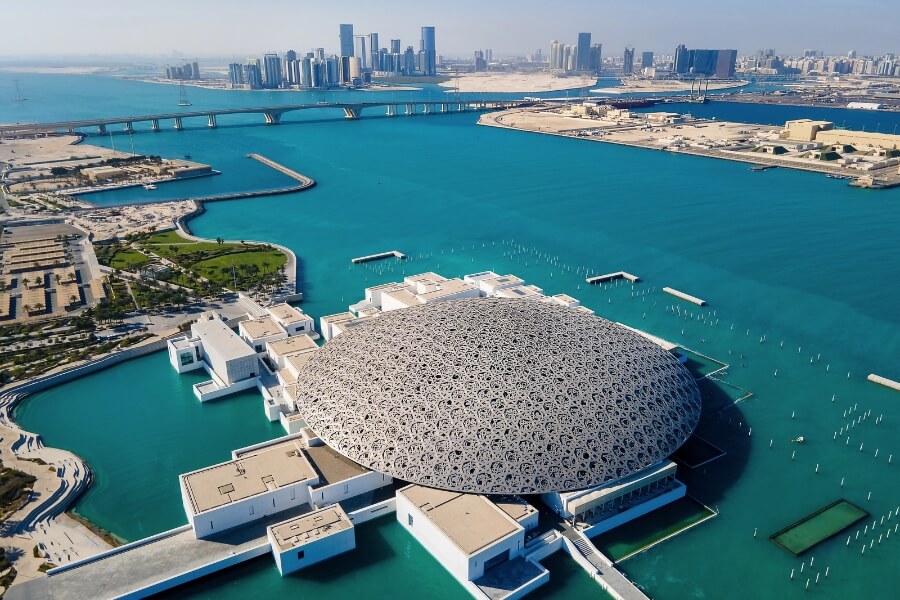 Louvre Abu Dhabi aerial view of Saadiyat island back to Abu Dhabi city