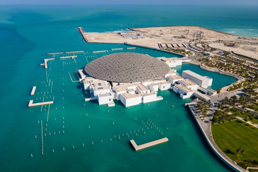 aerial view of the Louvre Abu Dhabi surrounded by Aqua Waters of The Persoan Gulf Depositphotos