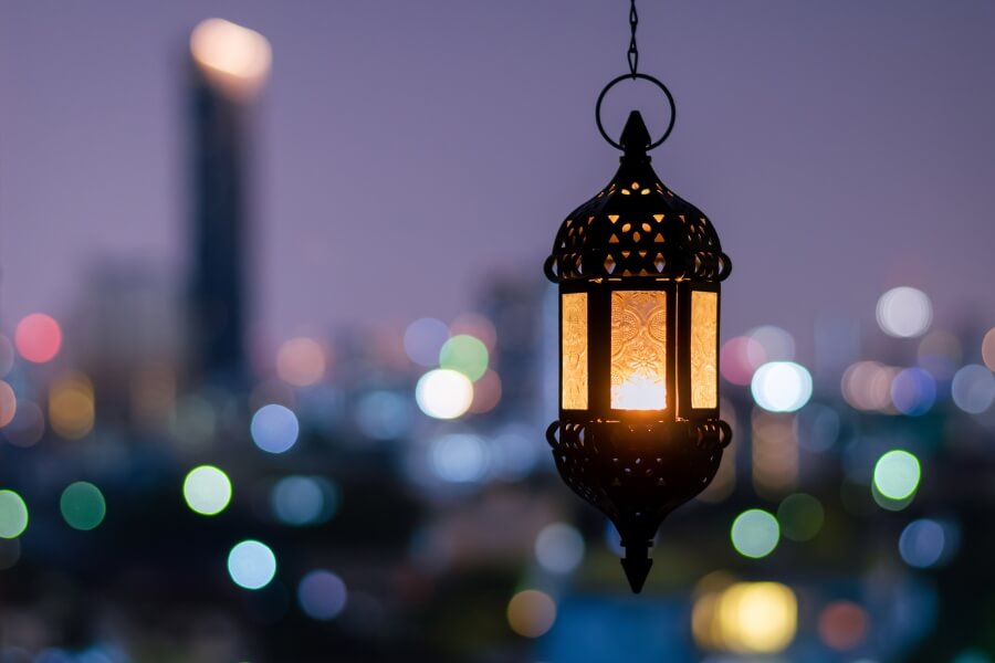 a ramadan lantern against the Abu Dhabi city skyline