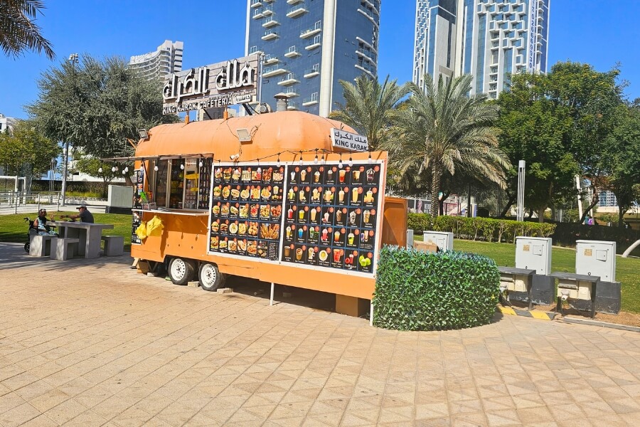 karak cafeteria food truck serving juices and fast food at reem central park