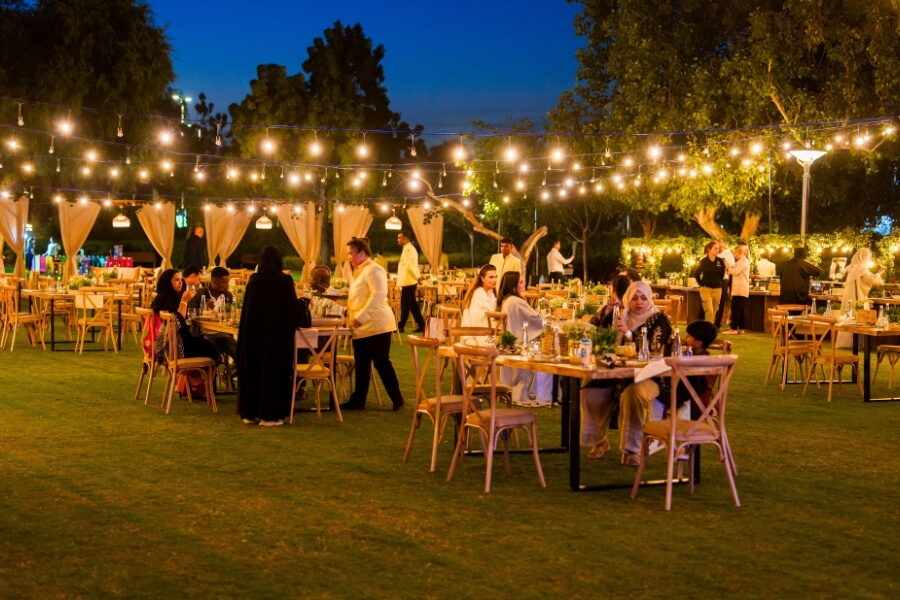 ramadan at the park, night time iftar at umm al emarat park meal seat up